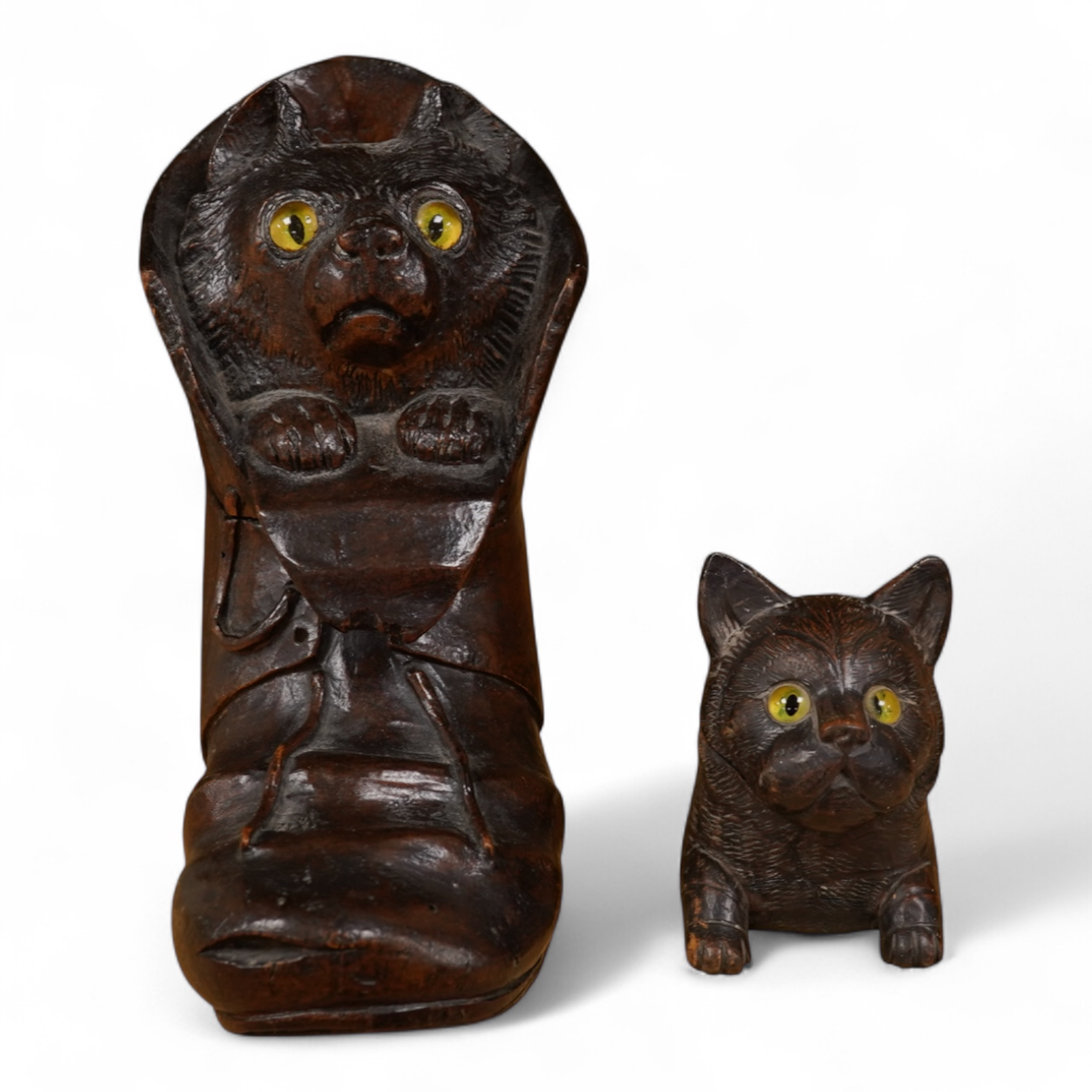 A Black Forest carving of a kitten in a boot inkwell and another car inkwell, tallest 15cm